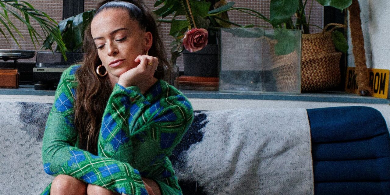 Carrie Baxter Gets “Under My Skin” — A Soulful Reckoning Wrapped in 90s Warmth